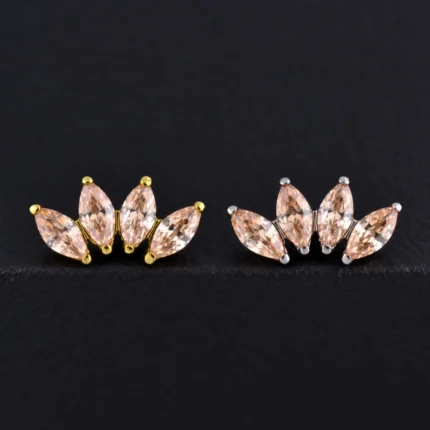 Top de piercing en titanio dorado y plateado con 4 circones marquesa color champaña en abanico